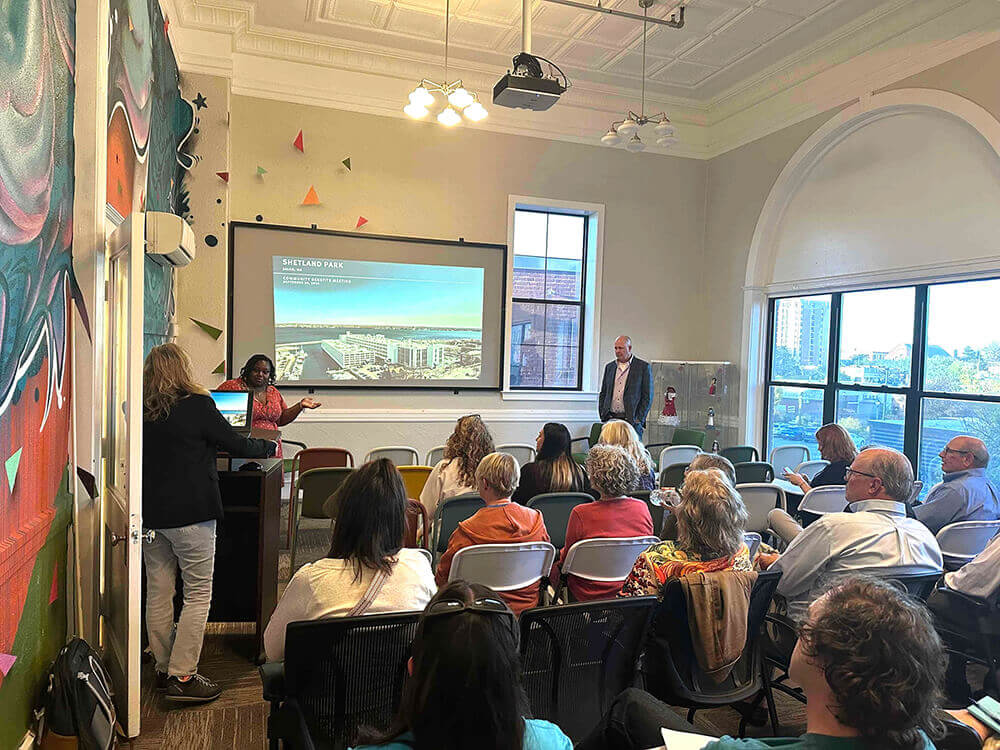 A crowd watching a presentation