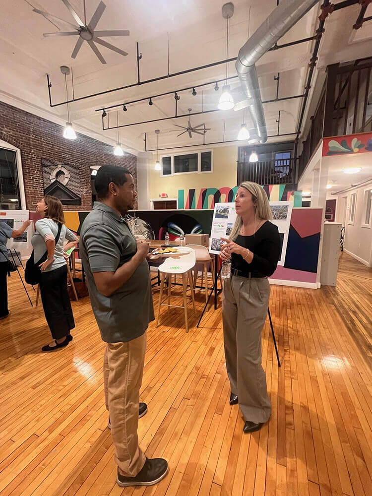 A man and woman standing and having a discussion